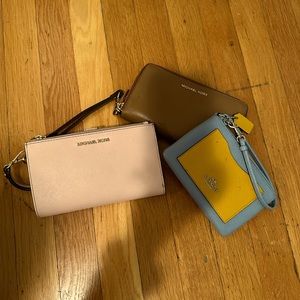 2 Michael Kors wallet and one Coach wristlet wallet